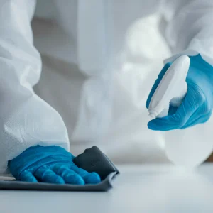 person-disinfecting-biohazard-area